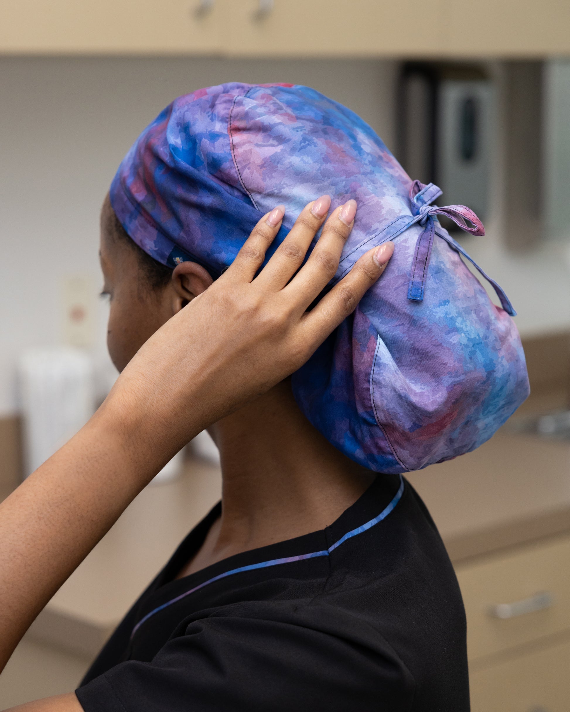 ENDYS Aurora bouffant scrub cap side view — built-in sweatband, fade-resistant watercolor print for healthcare professionals