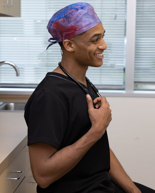 ENDYS Aurora unisex scrub cap side view — full hair coverage, fade-resistant watercolor print for healthcare professionals