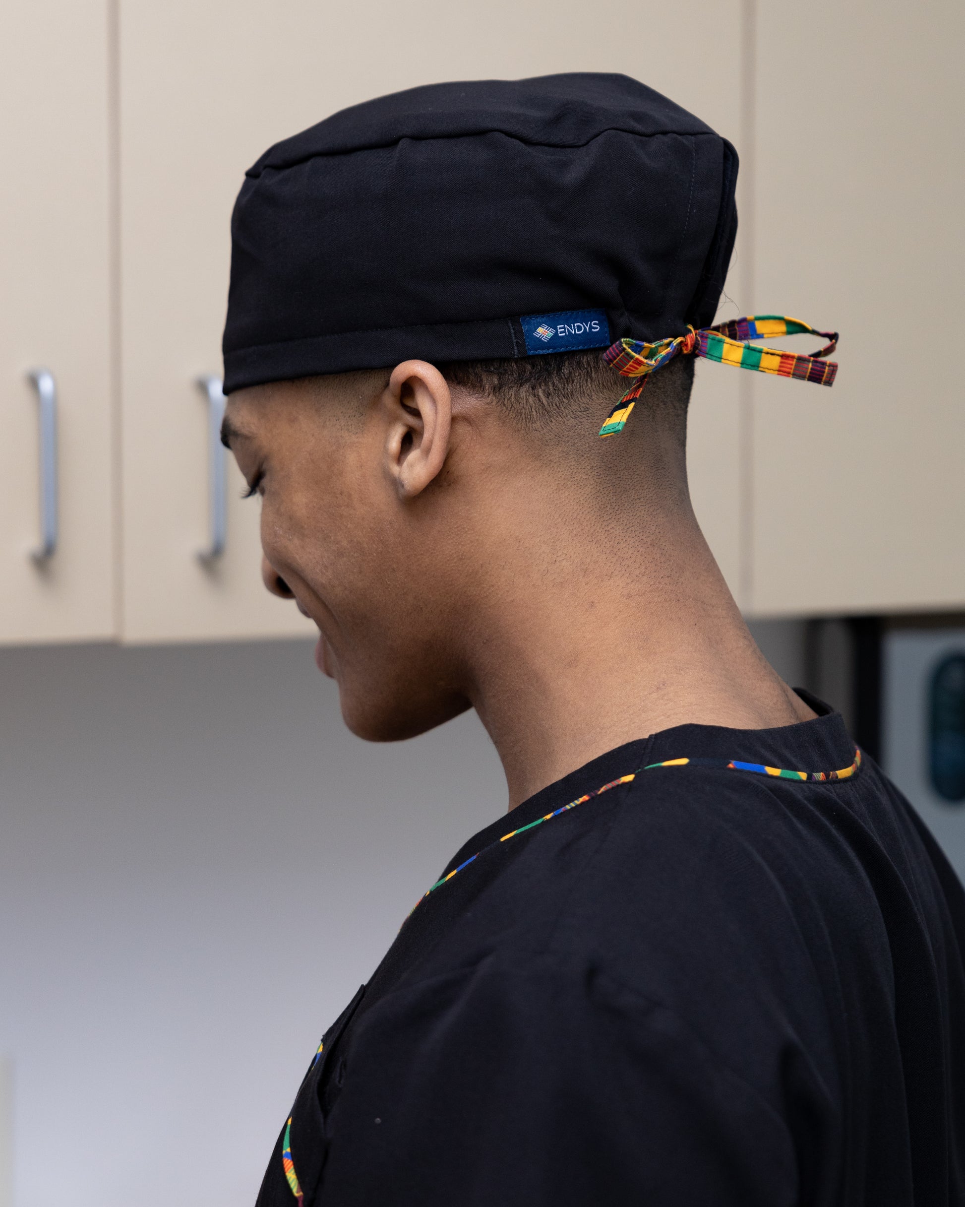 ENDYS black unisex scrub cap with Heritage Pop ties side view — full hair coverage, built-in sweatband