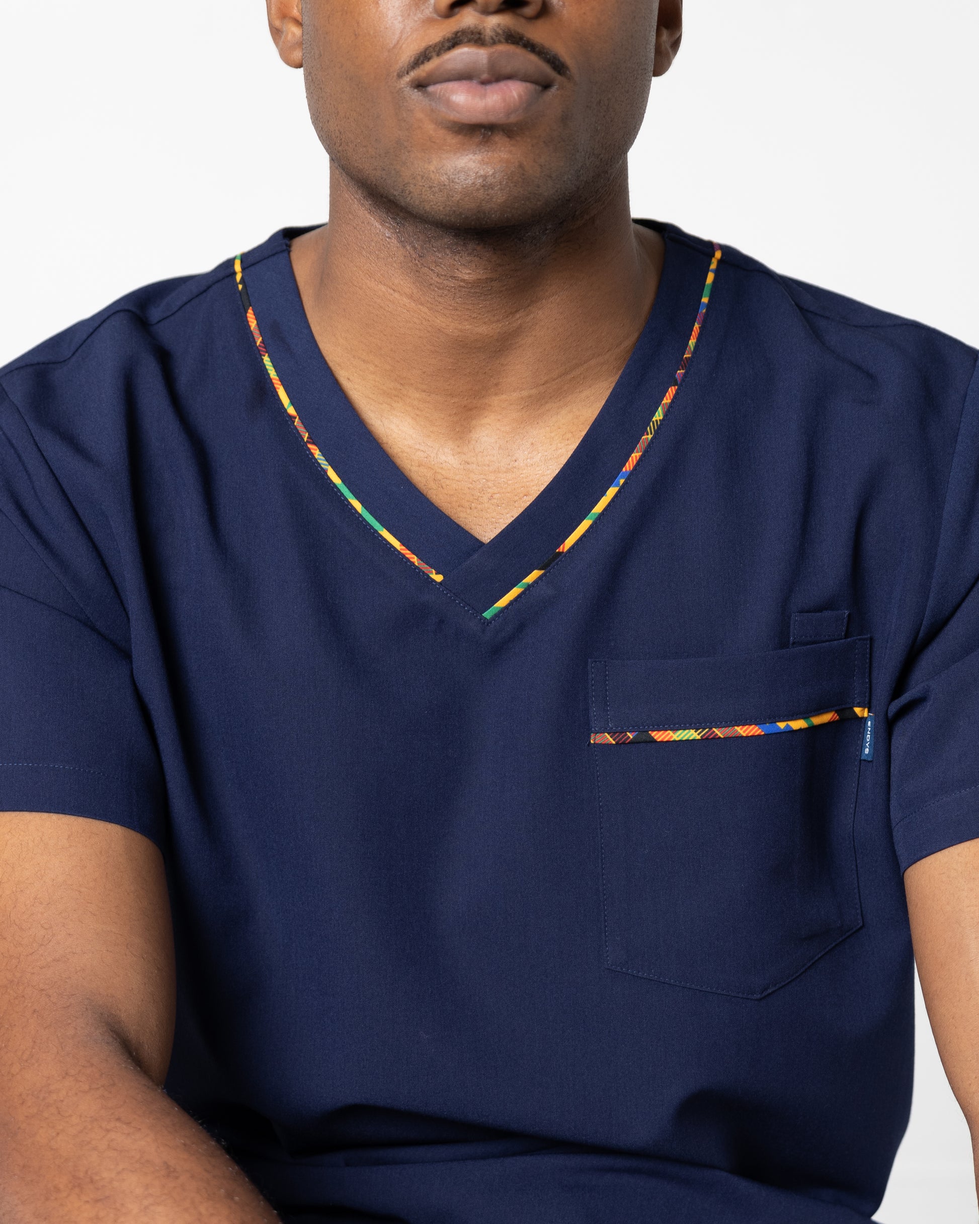 ENDYS Heritage Pop men's navy scrub top side view — moisture-wicking, tagless, athletic fit for long shifts